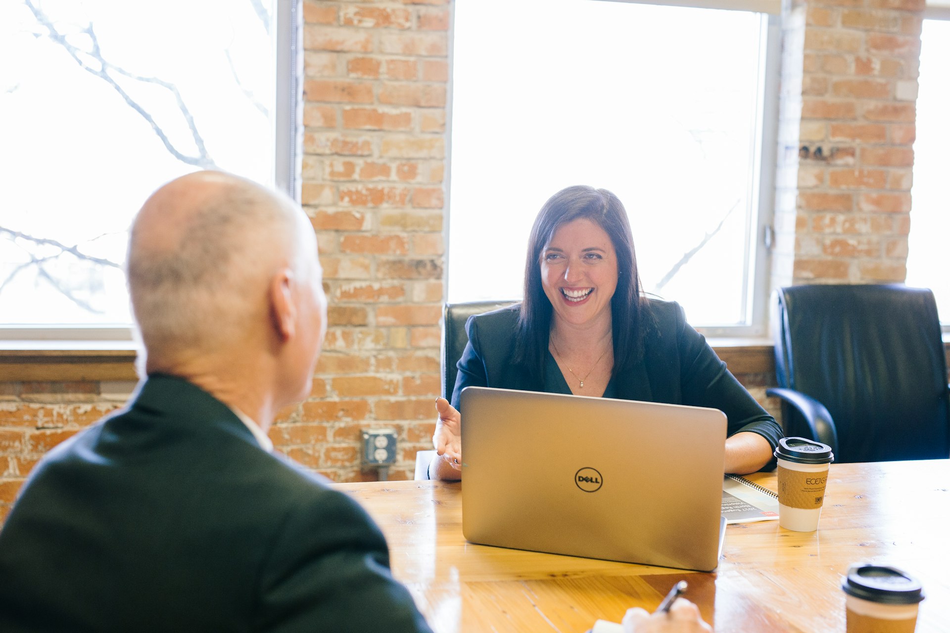Consultant reviewing analytics dashboard on a monitor